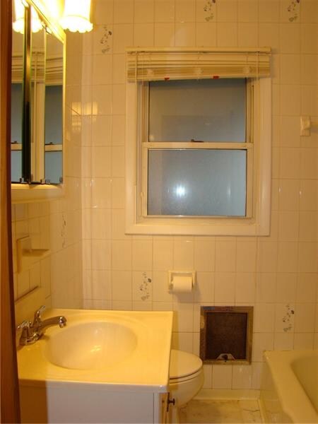Full updated walls to ceiling ceramic tile & marbl