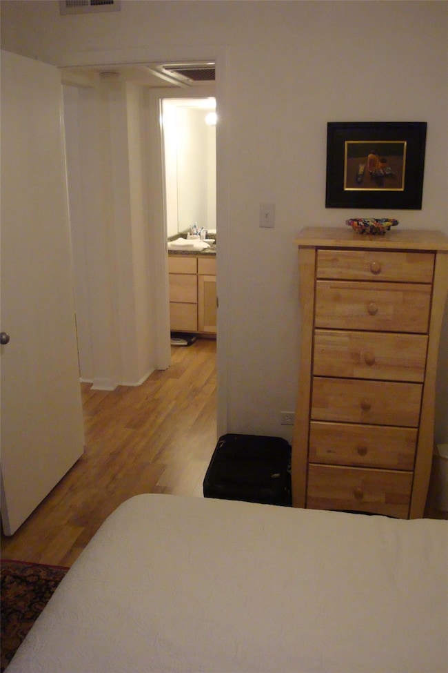 Bedroom featuring light wood-style flooring and a