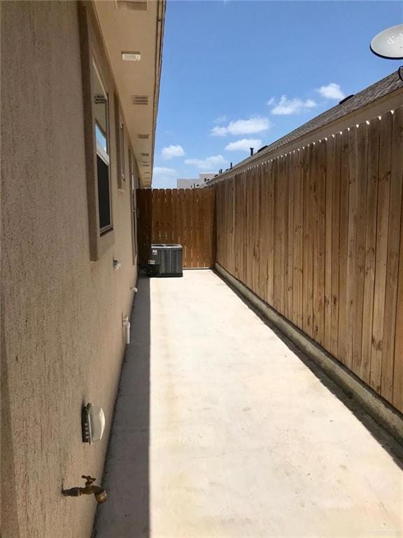 View of patio / terrace featuring central AC unit