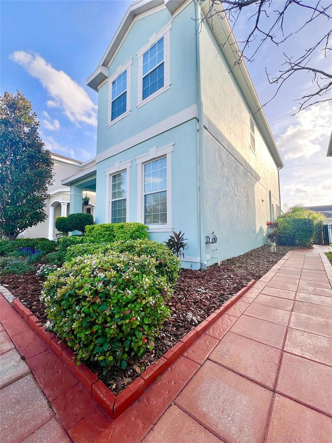 A custom-built walkway wraps around the front and side to the back of the home, and to the gated courtyard and garage.