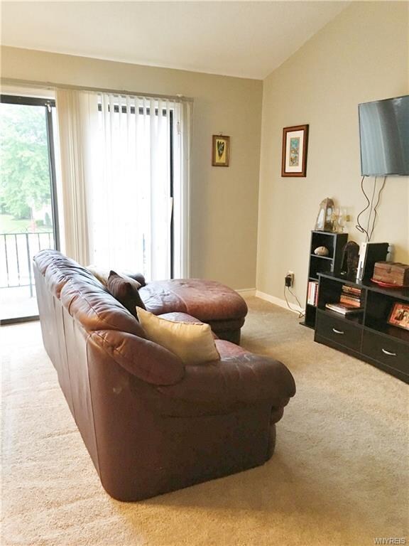 Living room area with sliding door to balcony.