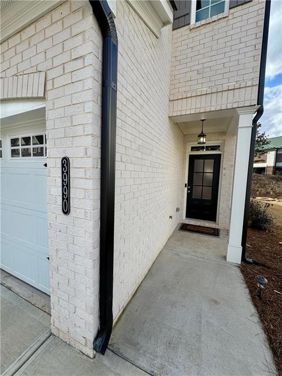 Entrance to property featuring a garage