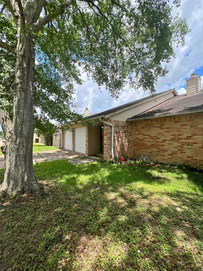  grassy front yard, offering a quaint and inviting