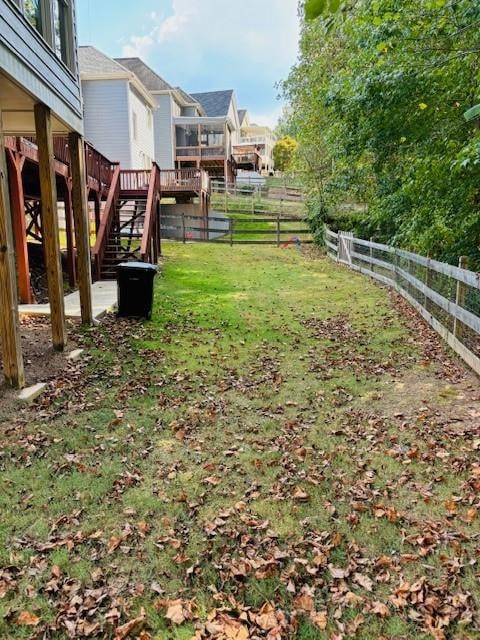 View of yard with a wooden deck