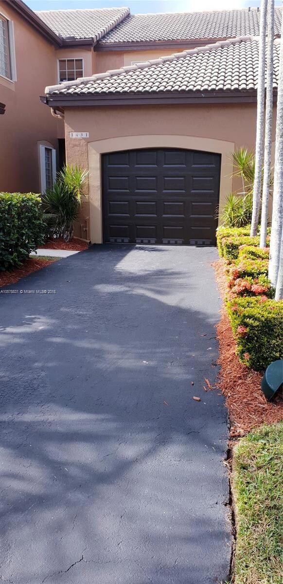 New Garage Door and resealed driveway