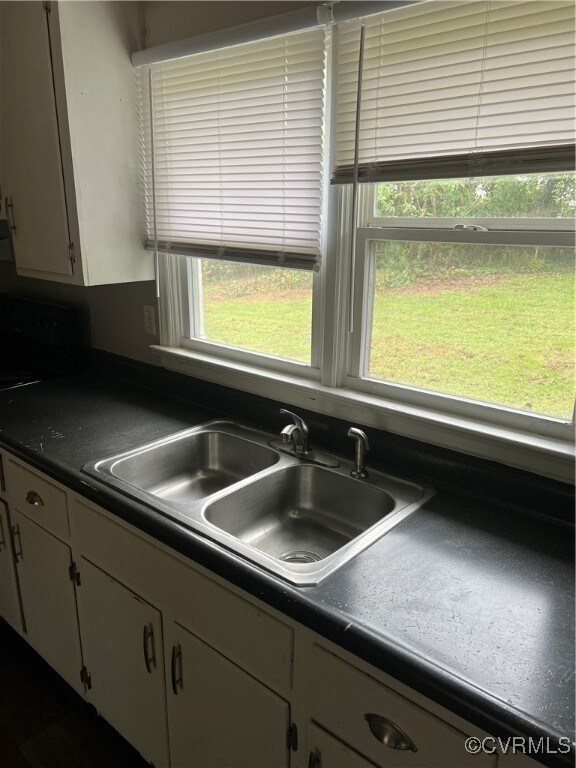 Kitchen with plenty of natural light and sink