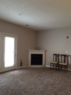 Living room with corner gas fireplace and new shor