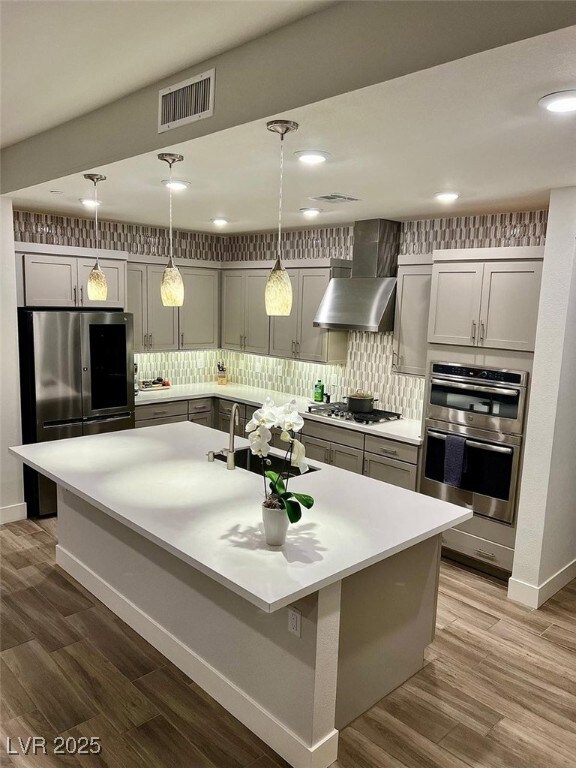 Kitchen with appliances with stainless steel finis
