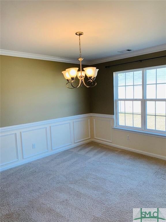 Dining room with chair rail and wainscoting..
