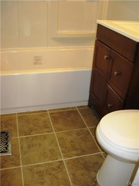 New Floor, Vanity, and Tub/Shower Surround.
