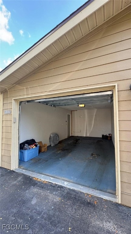 Garage with aphalt driveway