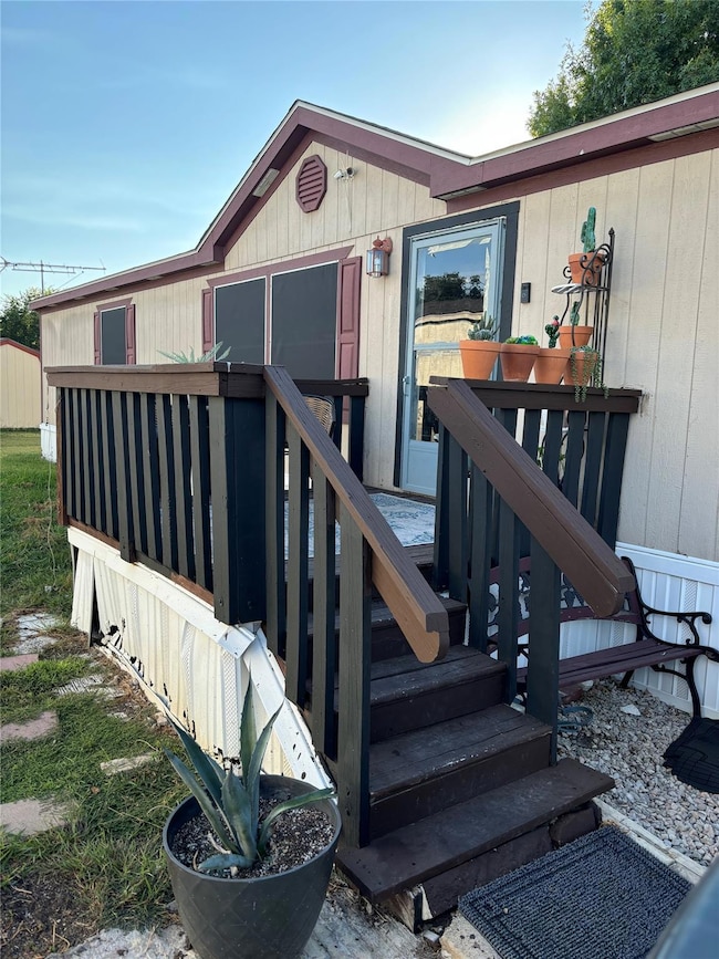 Property entrance featuring a deck