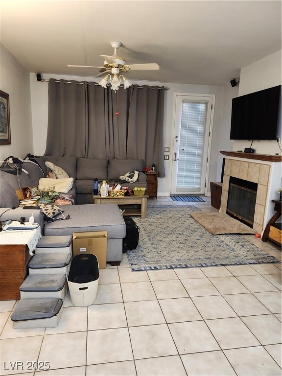 Living room featuring ceiling fan, light tile patt