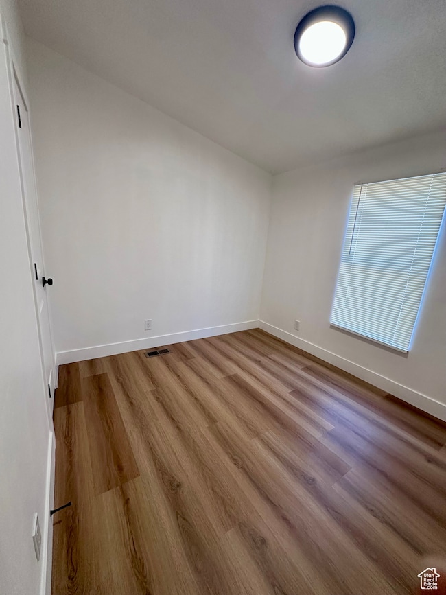 Unfurnished room featuring wood finished floors