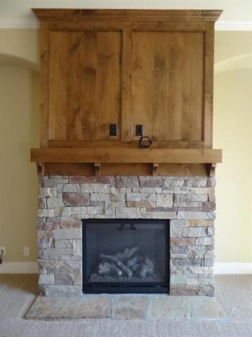 Lovely Stone and Wood Fireplace