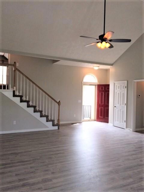 Stairs lead to finished bonus over garage