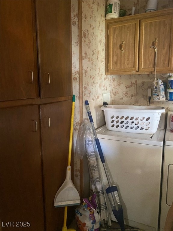Washroom featuring wallpapered walls, washing mach