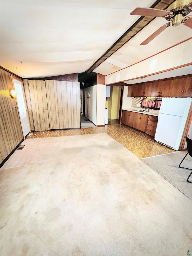 Interior space with freestanding refrigerator, lof