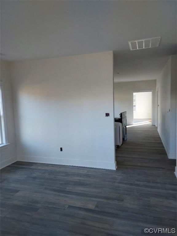Interior space featuring dark wood-type flooring