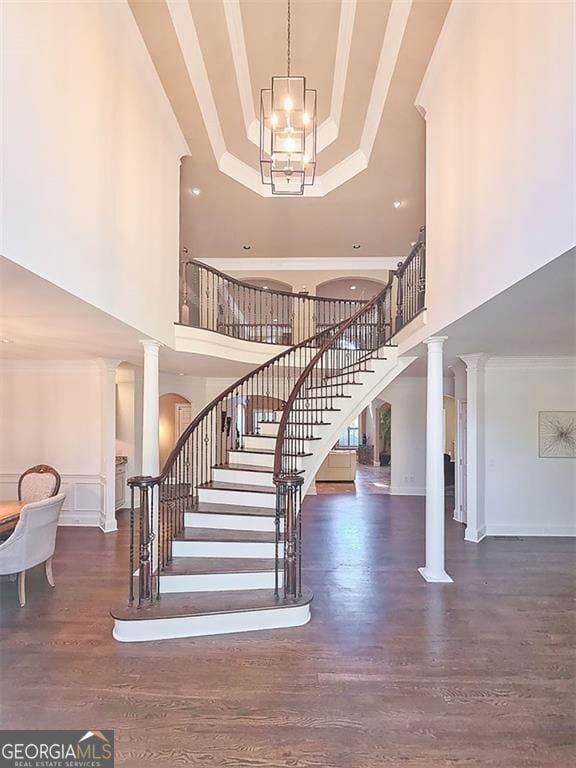 Stunning free-standing circular stairway in the two story stairway