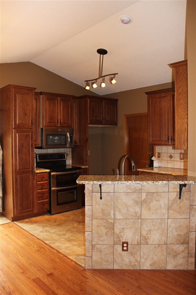 ...updated kitchen with oak cabinets...