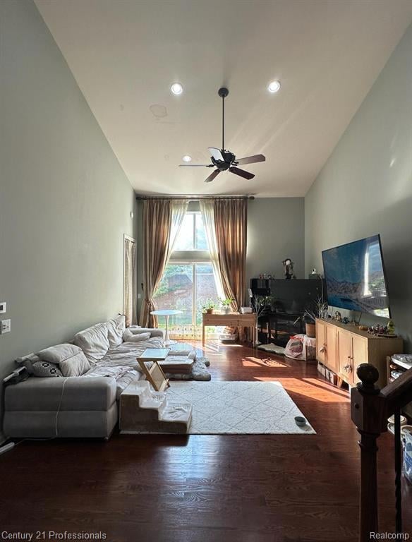 Living room with ceiling fan, wood finished floors, and recessed lighting