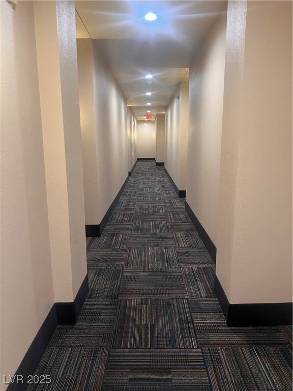 Make a right down the Hallway featuring dark carpe