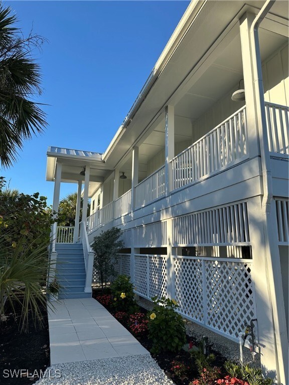 View of property exterior with stairs