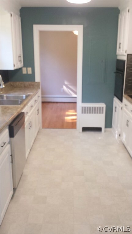 Kitchen with New Vinyl, door to DiningRoom