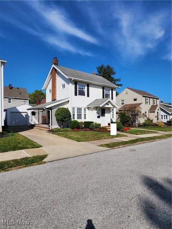 View of front of house featuring a carport