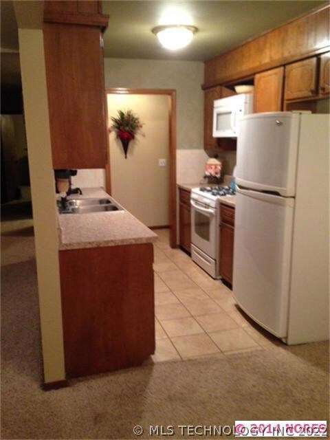 In the updated kitchen, looking from the dining, y