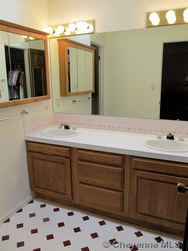 Double vanity sinks with skylights and a walk-in c