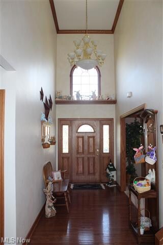 Beautiful 2 story foyer with wood floors.