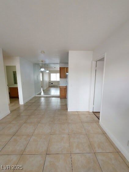 Spare room featuring light tile patterned floors a