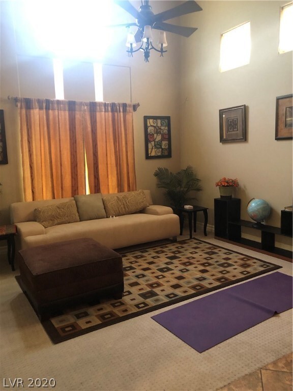 Formal Living room has vaulted ceiling with lots o