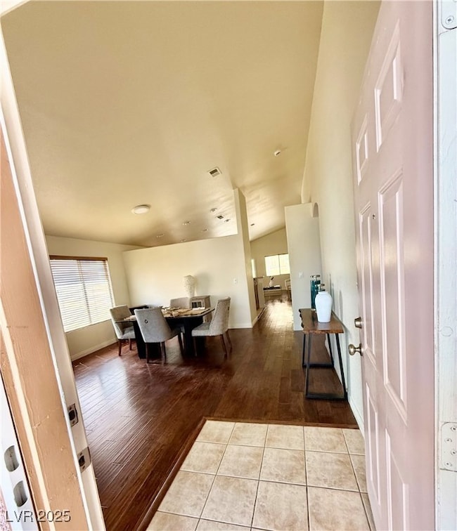 Dining space featuring visible vents, hardwood / w