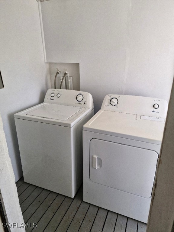 Laundry room with laundry area, washer and clothes