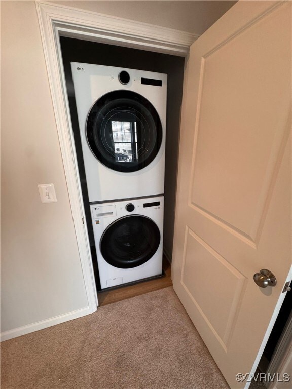 Clothes washing area with stacked washer and cloth