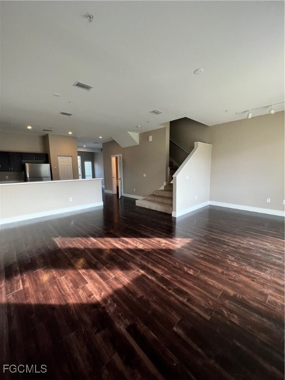 Unfurnished living room with wood finished floors