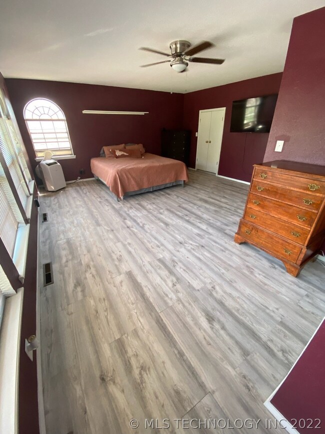 Bedroom 1 (upstairs) with wall of windows, ensuite