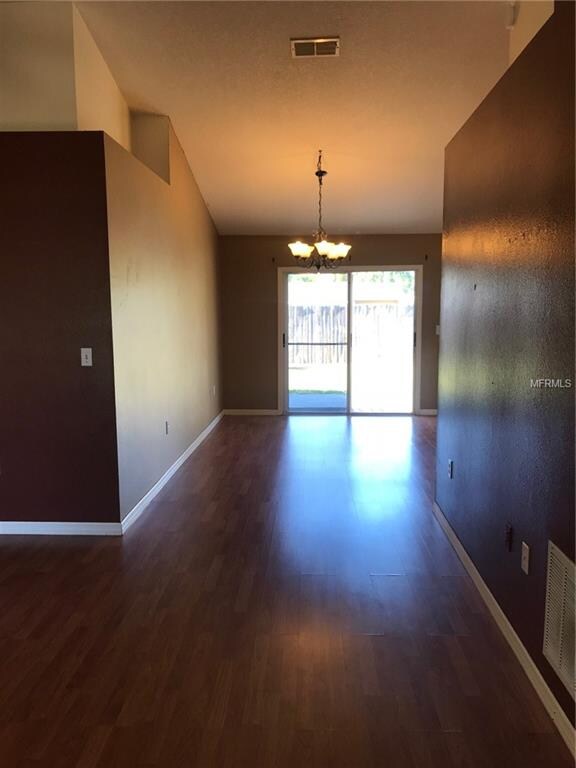 Laminate flooring continues through dining room