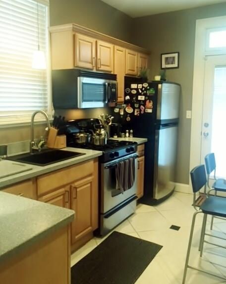 New kitchen, maple cabinets, solid surface counter