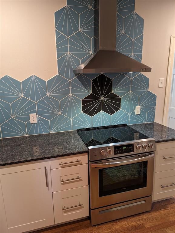 Kitchen featuring stainless steel electric stove,