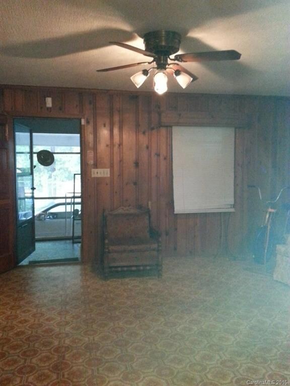 Large Den and Kitchen - open floor plan with lots of room. Door leads to screened porch, carport and laundry/utility rooms.