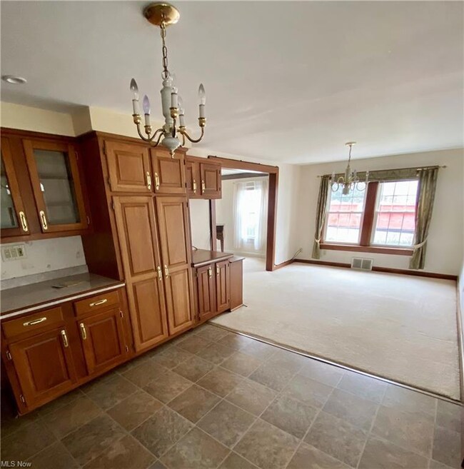 EAT IN KITCHEN WITH CUSTOM CABINETRY.