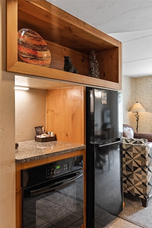 Kitchen with black appliances