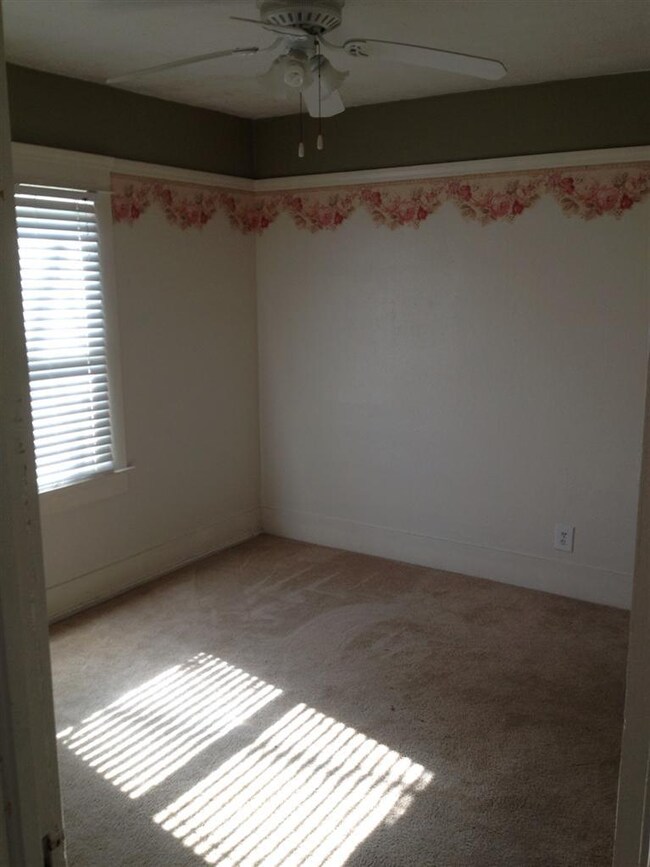 1st bedroom with ceiling fan