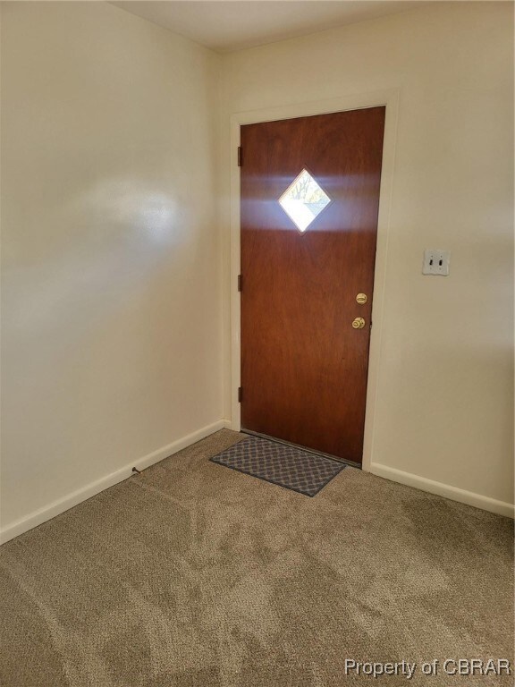 View of carpeted foyer entrance