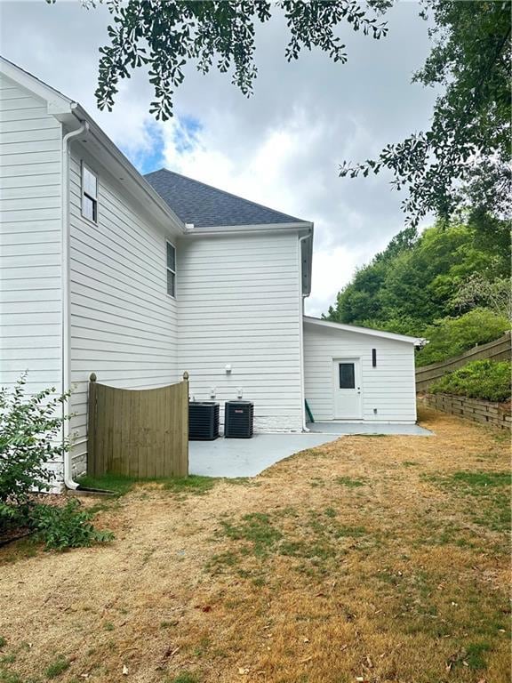 Rear view of property with a patio area, central a