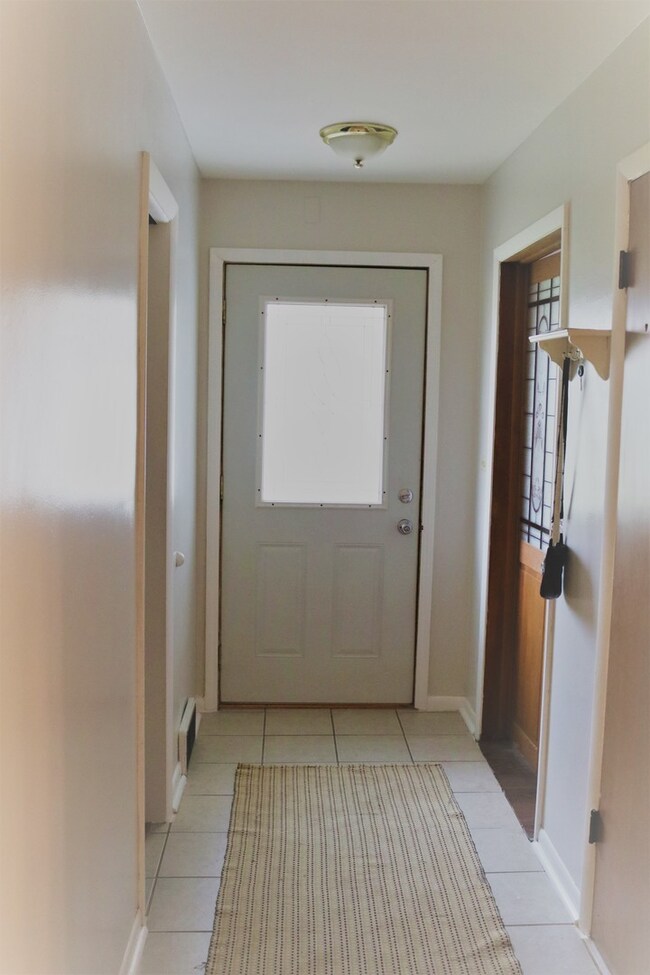 Entryway hall includes Closet and access to Baseme